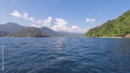 Beautiful lanscape, sea and hills. The sky is cloudly blue. Forward motion scene. Mandeh, Pesisir Selatan, Indonesia photo