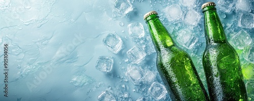 Wallpaper Mural Top view of two green beer bottles surrounded by ice cubes on a light blue background, highlighting cool refreshment and summer vibes. Torontodigital.ca