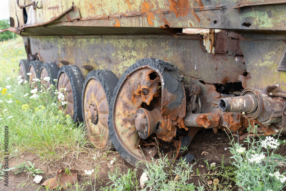 Rusty old soviet military vehicle wreck wheels in a field Rusty old soviet military vehicle wreck wheels in a field