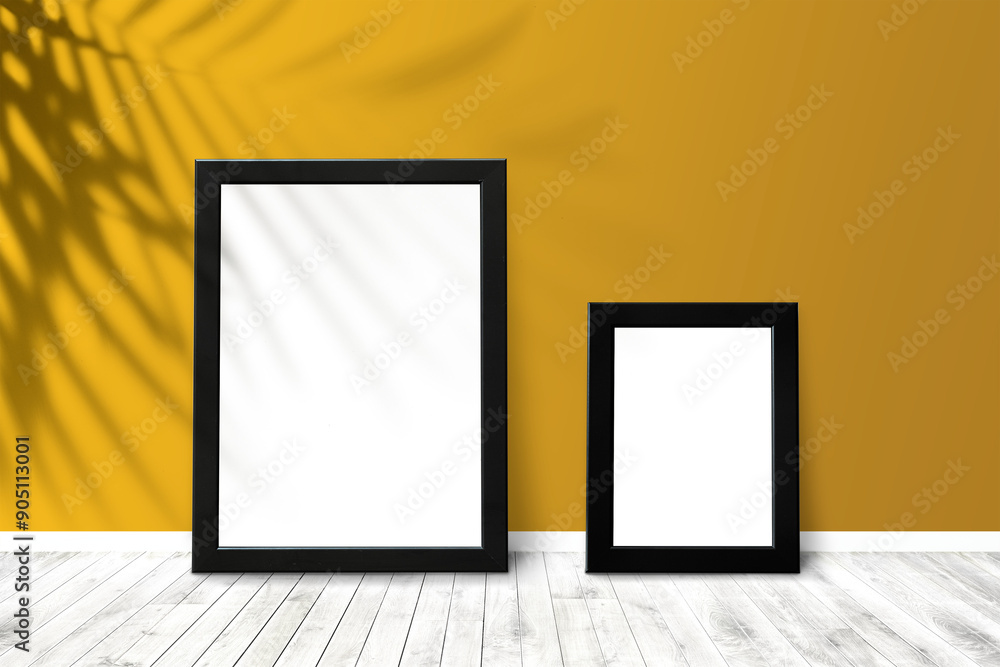 Black picture frame mockups against a yellow wall Black picture frame mockups against a yellow wall