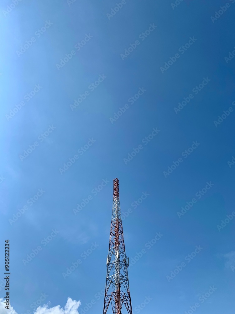 cell phone antenna tower on blue sky background cell phone antenna tower on blue sky background