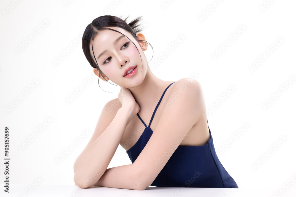 Obraz premium Beautiful young Asian woman with K beauty style makeup and perfect skin on isolated white background. Facial and skin care concept for commercial advertising.