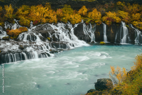 Autumn view of the beautiful Hraunfossar Waterfall in Iceland, with streams flowing in the river