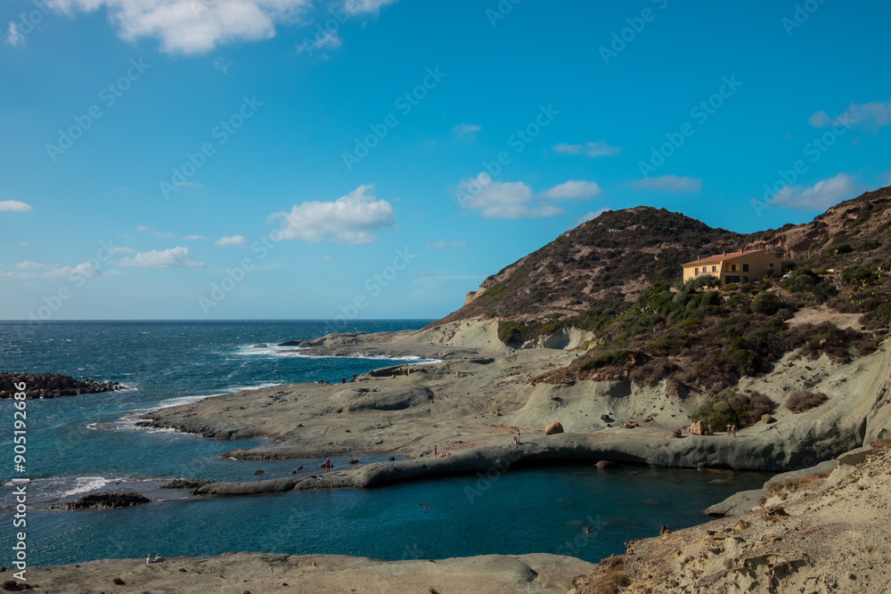 Rocky vulcanic beaches and high mountains of Sardinia island, Italy Rocky vulcanic beaches and high mountains of Sardinia island, Italy