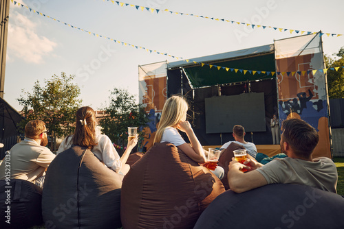 Photography Music festival, Group of people, men and women, friends gathering outdoor to on warm summer day, drinking beer, watching concert