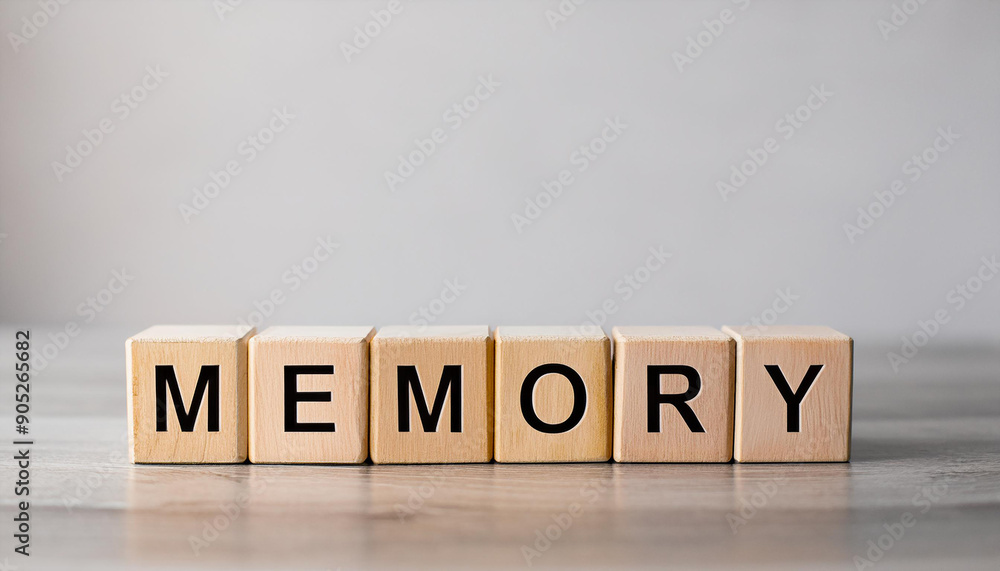 Wooden cubes with word MEMORY on table against light gray background. Wooden cubes with word MEMORY on table against light gray background.