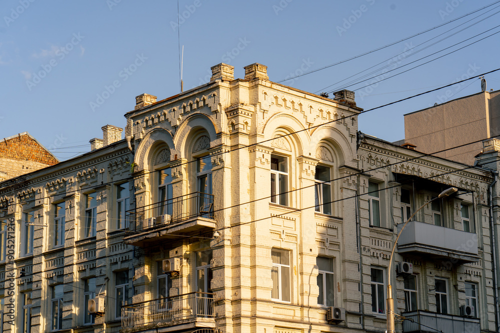 Fototapeta premium street ancient houses a old windows and balconies Soviet architecture pastel colors of painted houses architectural stucco