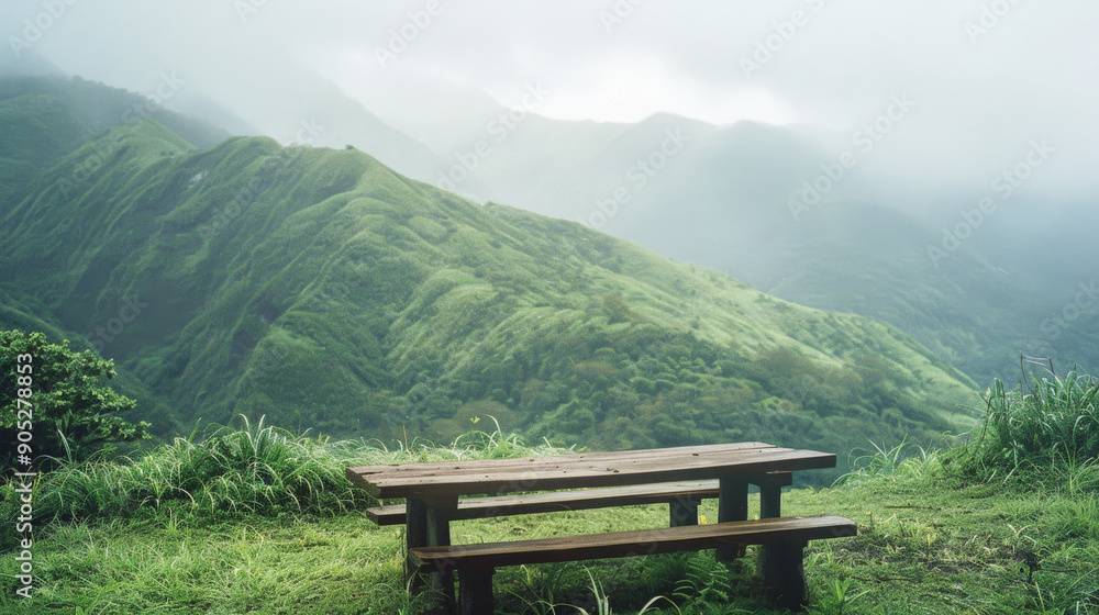 A serene wooden bench overlooking lush green mountains shrouded in mist, evoking a sense of peace and solitude in nature. A serene wooden bench overlooking lush green mountains shrouded in mist, evoking a sense of peace and solitude in nature.