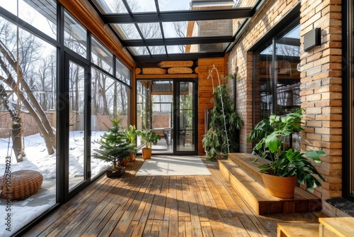 Chic winter garden with glass roof and wooden floors