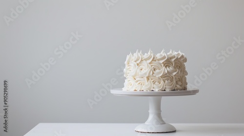 Beautiful chic white cake on a white background. Concept of cakes for birthday, wedding, anniversary.