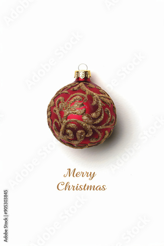 Elegant red Christmas ornament with intricate gold design on a white background featuring "Merry Christmas" text, perfect for holiday greeting cards and festive decorations