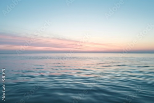 a body of water with a sky in the background