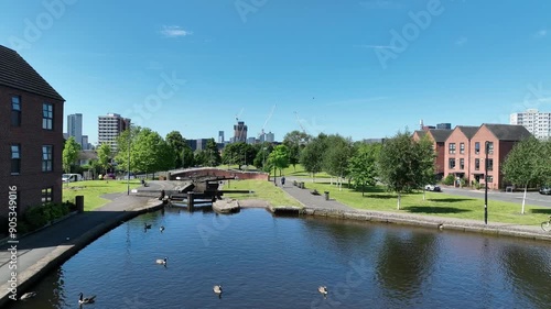 Geese on the canal and modern houses in New Islington, Ancoats, Manchester photo