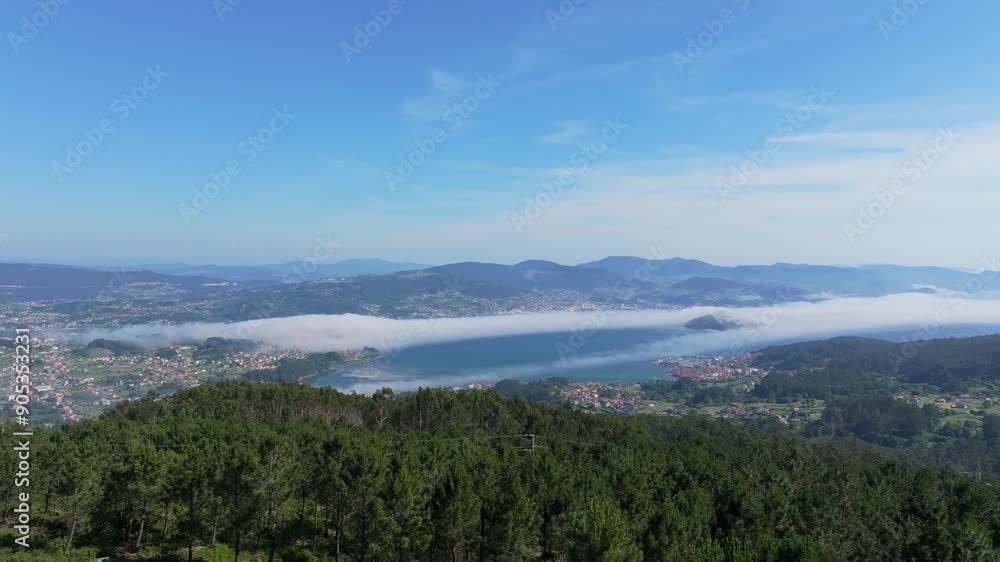 Scenic aerial view of mountains and coastal towns during sunrise near Pontevedra, Spain Scenic aerial view of mountains and coastal towns during sunrise near Pontevedra, Spain