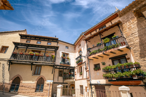 Town hall square in Ademuz, Comunitat Valenciana, Spain, with typical buildings with wooden balconies