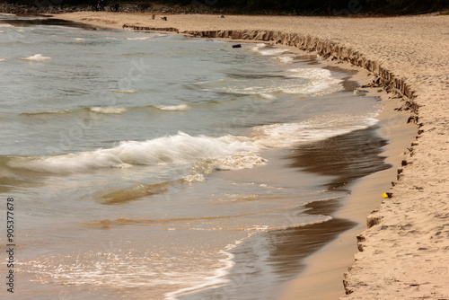 Photography The incoming waves of Lake Michigan are actively eroding the beach shoreline in