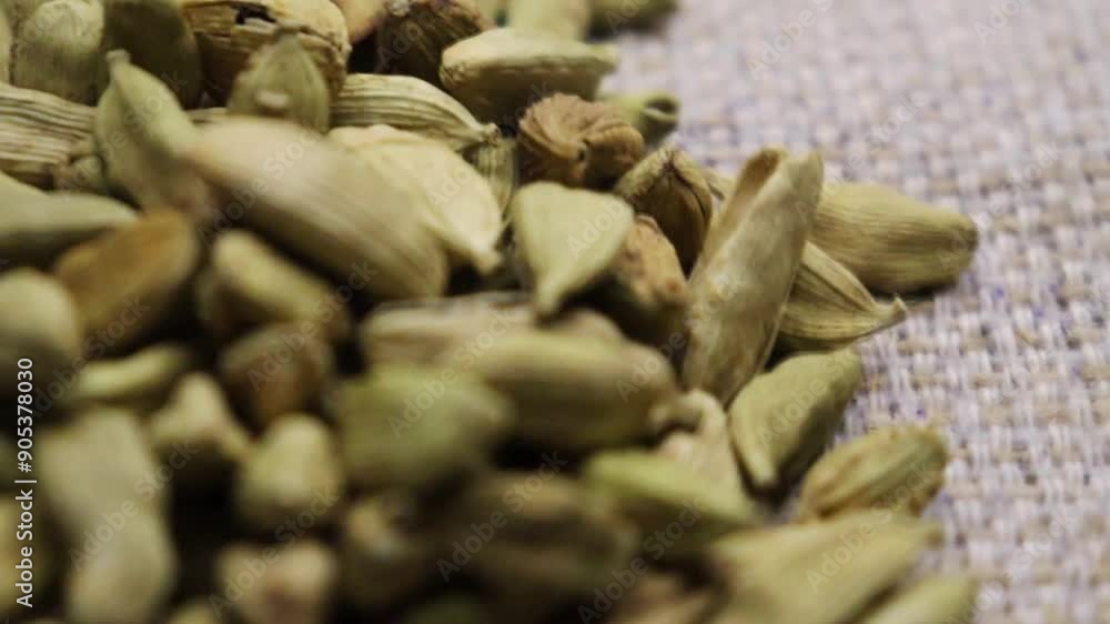 Pile of green cardamom seeds, rotating, rotation and spinning. Green cardamom circle around 4k footage. Pile of green cardamom seeds, rotating, rotation and spinning. Green cardamom circle around 4k footage.