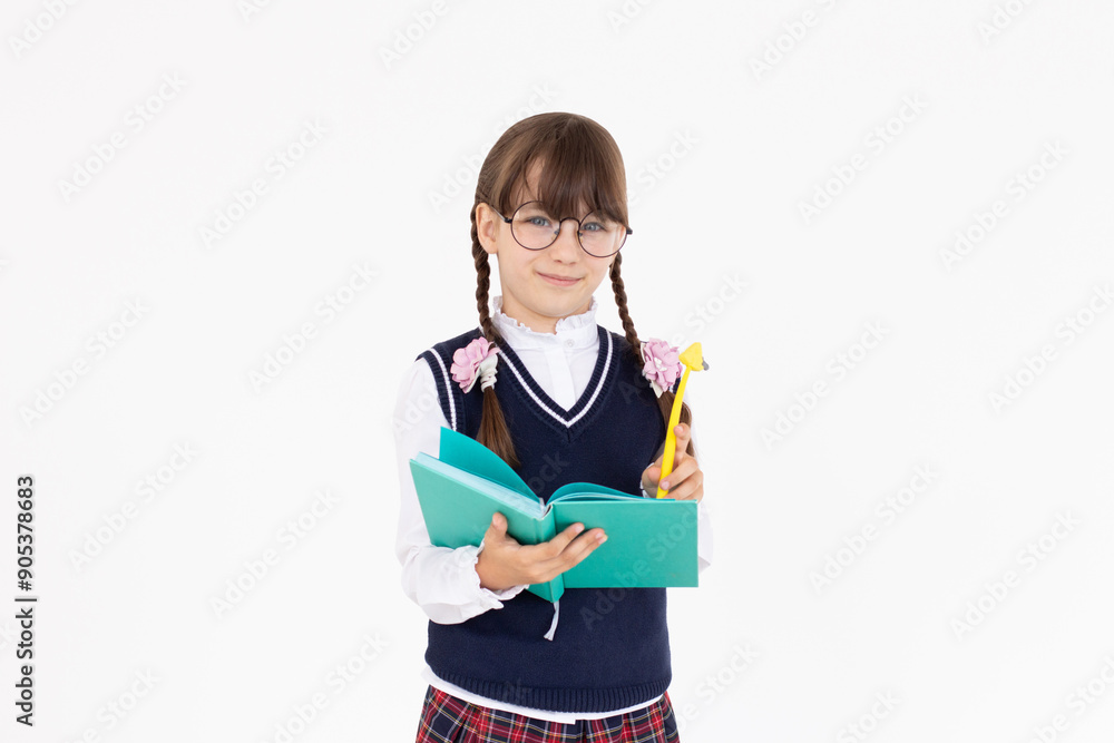 Pupil hold planner. back to school. education. agenda. happy child write in notebook. Portrait of schoolgirl student, studio banner header. School child face, copyspace. Pupil hold planner. back to school. education. agenda. happy child write in notebook. Portrait of schoolgirl student, studio banner header. School child face, copyspace.