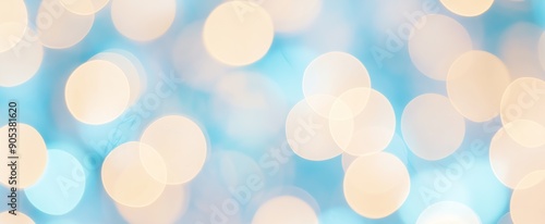 Bright holiday bokeh with hot yellow lights blurred on teal blue background