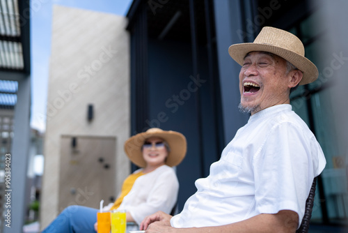 elderly senior people laughing out lound while traveling as couple wellness, group of asian gray-hair man woman active happy retirement adult enjoy summer vacation at swimming pool photo