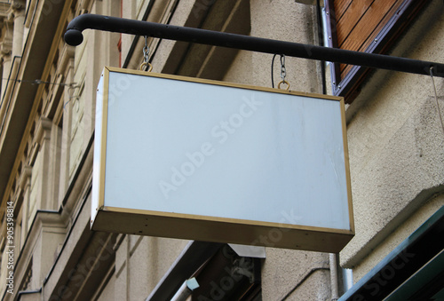 Street storefront shop, cafe, restaurant mounted signboard mock up design template. Blank white store sign design mockup.