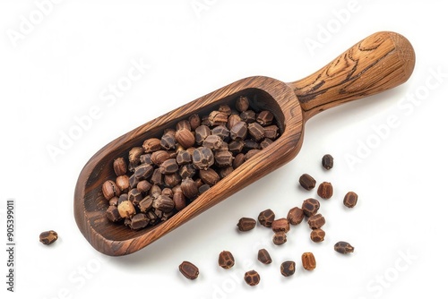 Top view of a wooden scoop filled with organic mace myristica fragrans or javitri on a white background photo