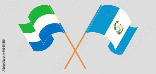 Crossed and waving flags of Sierra Leone and Republic of Guatemala