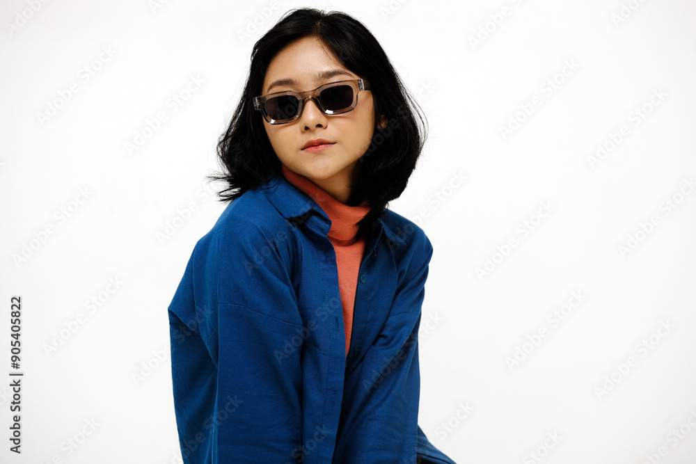 Beautiful asian woman wearing sunglasses looking at camera isolated on white background Beautiful asian woman wearing sunglasses looking at camera isolated on white background