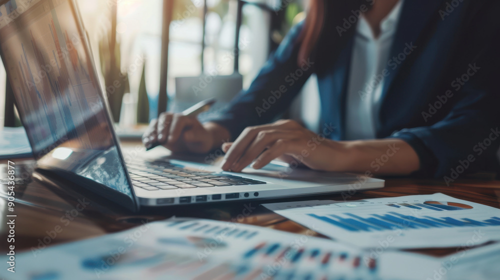 Business analyst interpreting data from financial graphs to provide insights on company performance. Business analyst interpreting data from financial graphs to provide insights on company performance.