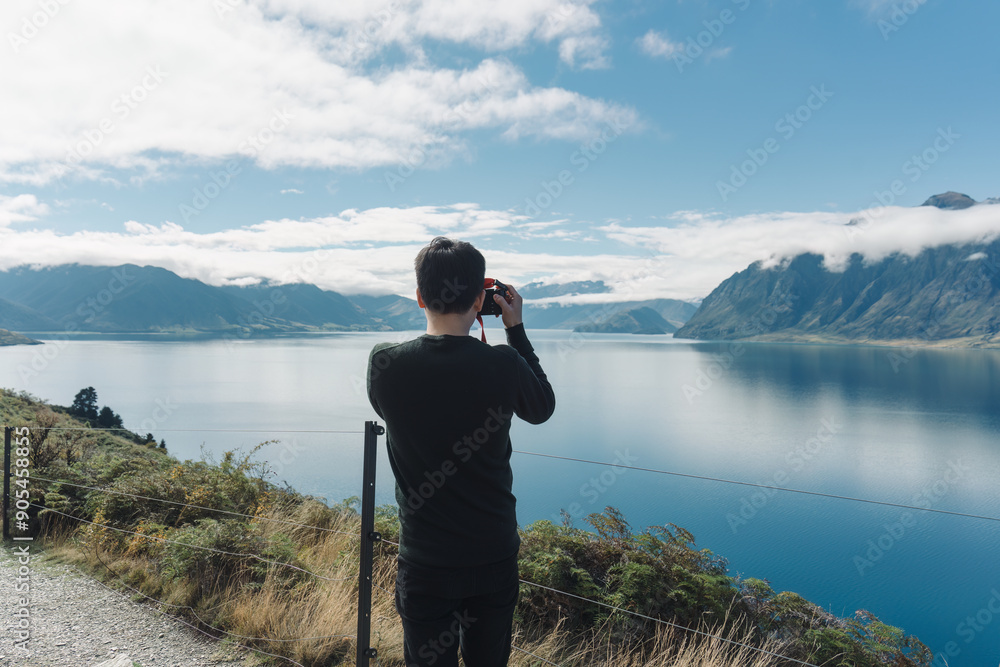 custom made wallpaper toronto digitalHappy asian man taking a photo with scenic lookout of Lake Hawea in autumn