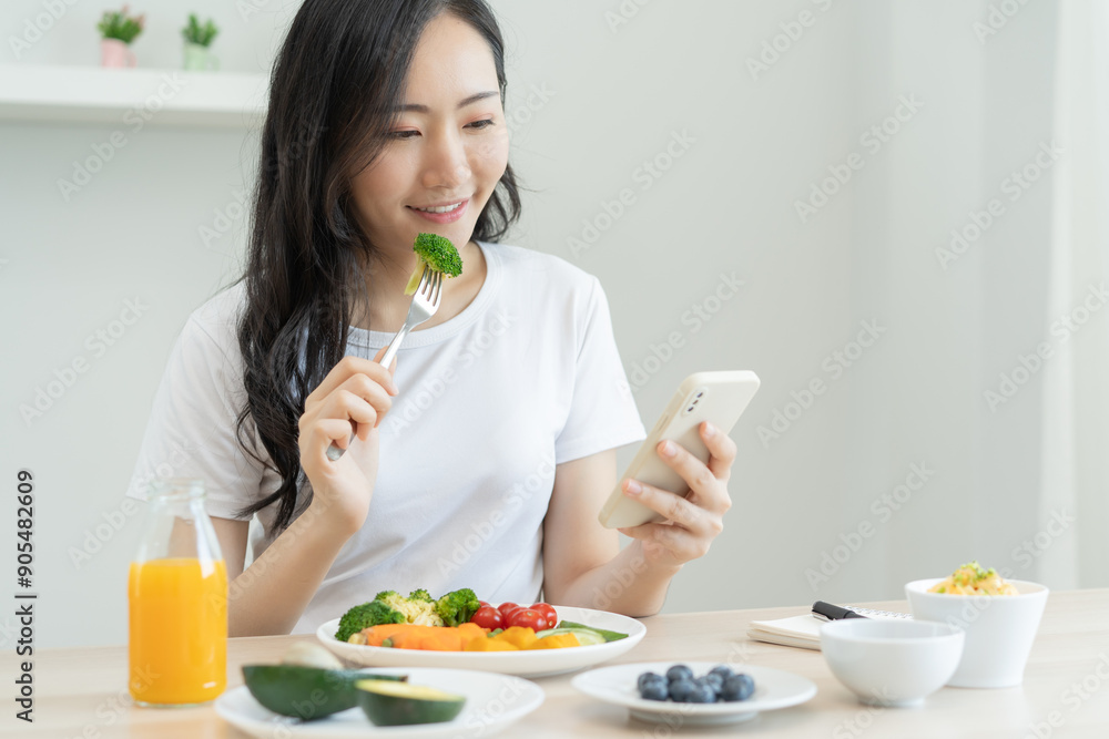 young female planning menu to eat ketogenic diet during weight loss program. young female planning menu to eat ketogenic diet during weight loss program.