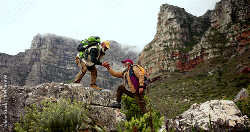 Photography Mountain, hiking and senior men with helping hand for support, physical activity or climbing together