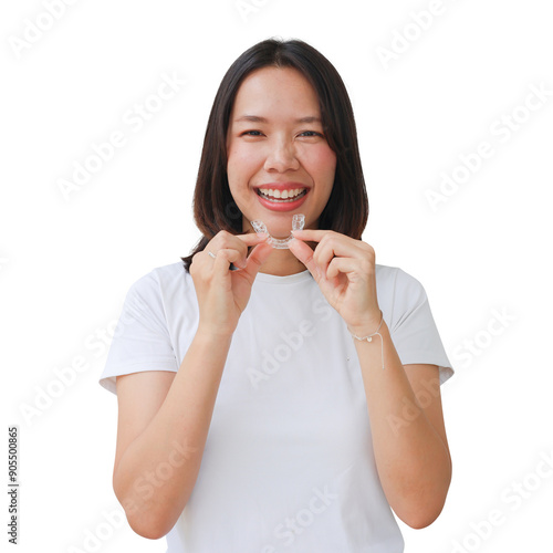 close up young asian woman smiling with hand holding dental aligner retainer (invisible) at dental clinic for beautiful teeth treatment course and png design concept