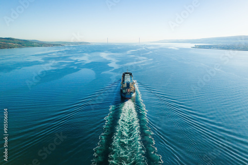 Bulk cargo carrier ship underway in calm sea. Dry cargo vessel merchant ship to transport bulk cargo such as grains ore coal