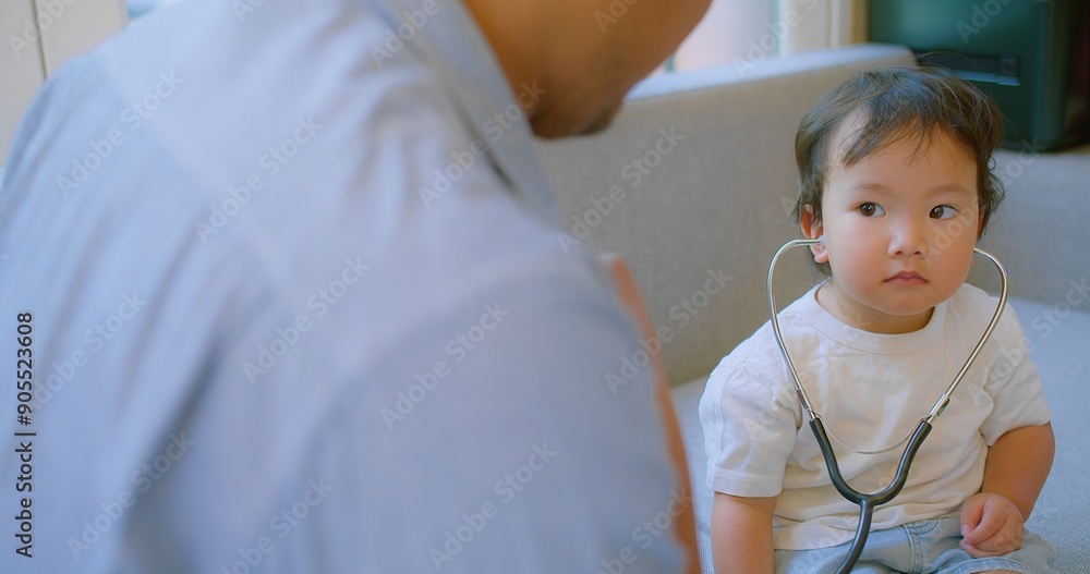 cute small child and father game as Doctor holding Stethoscope listening to father patient pretending nurse having fun with dad in cozy living room at home, capturing a heartwarming family moment. cute small child and father game as Doctor holding Stethoscope listening to father patient pretending nurse having fun with dad in cozy living room at home, capturing a heartwarming family moment.