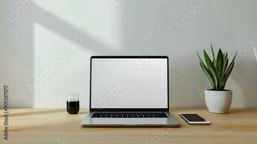 Wallpaper Mural Minimalist desk setup with a laptop and iPhone, showcasing white screens for design presentation Torontodigital.ca