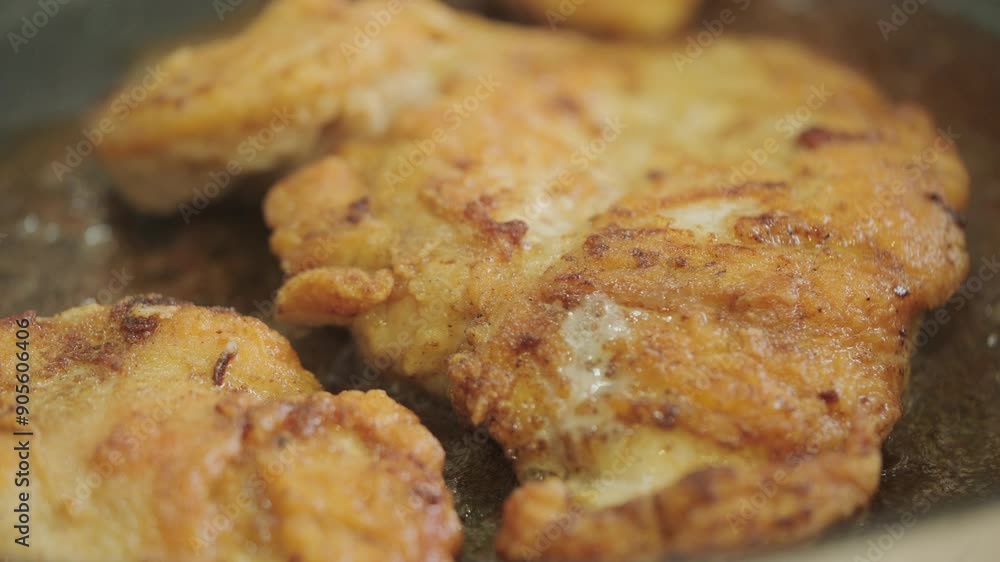 Free range chicken cooking in pan close up Free range chicken cooking in pan close up