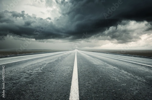 Dramatic Sky Over Lonely Asphalt Road Stretching Into the Distance