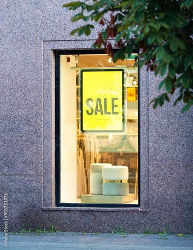 Sale sign in a luxury brand store window
