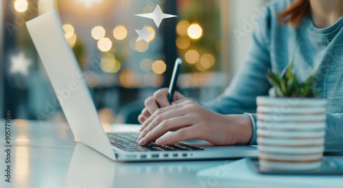 Person Writing on Laptop With Blurred Background in Cozy Indoor Setting at Su...