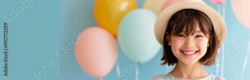 Happy Child With Balloons Celebrating a Birthday in a Colorful Room