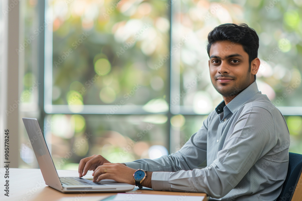 Young Indian Man in Suit Working on Laptop Young Indian Man in Suit Working on Laptop