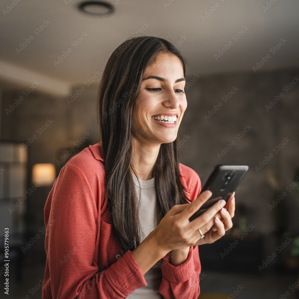 Portrait of adult young woman stand hold and use mobile phone Portrait of adult young woman stand hold and use mobile phone