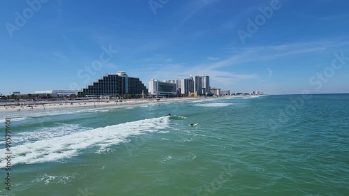 Coastline with surfers and waves north view