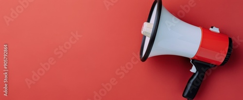 Bright Red Megaphone Positioned Against Solid Red Background