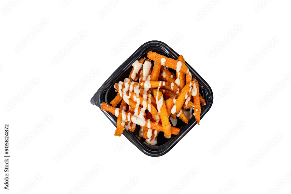 Freshly prepared sweet potato fries drizzled with a creamy sauce sit in a black container