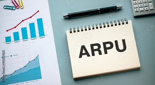 There is notebook with the word ARPU. It is an abbreviation for Average Revenue Per User as eye-catching image. photo