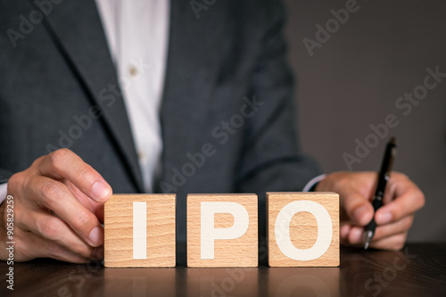 There is wood cube with the word IPO. It is an abbreviation for Initial Public Offering as eye-catching image.