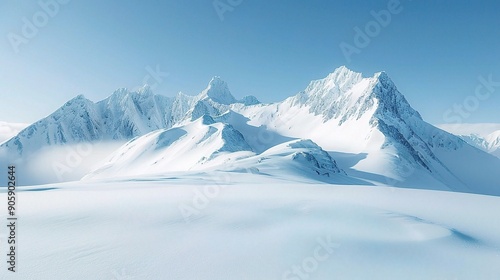 Majestic Winter Wonderland: Serene snow-capped peaks pierce a cerulean sky in this breathtaking vista of pristine alpine beauty. 