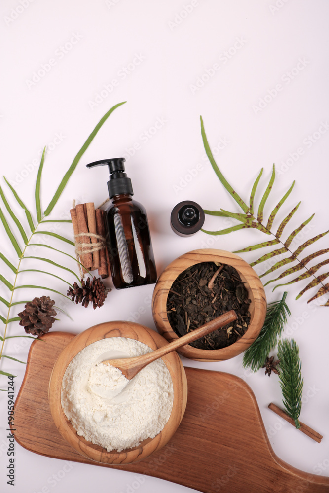 Natural Skincare Ingredients with Amber Bottle and Botanical Elements on White Background Natural Skincare Ingredients with Amber Bottle and Botanical Elements on White Background